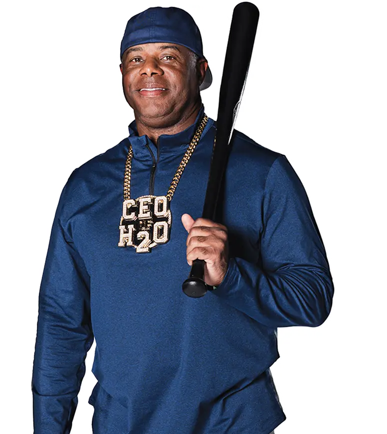 Ken Griffey Jr. in a blue outfit holding a black baseball bat, wearing a large "CEO H20" chain necklace.